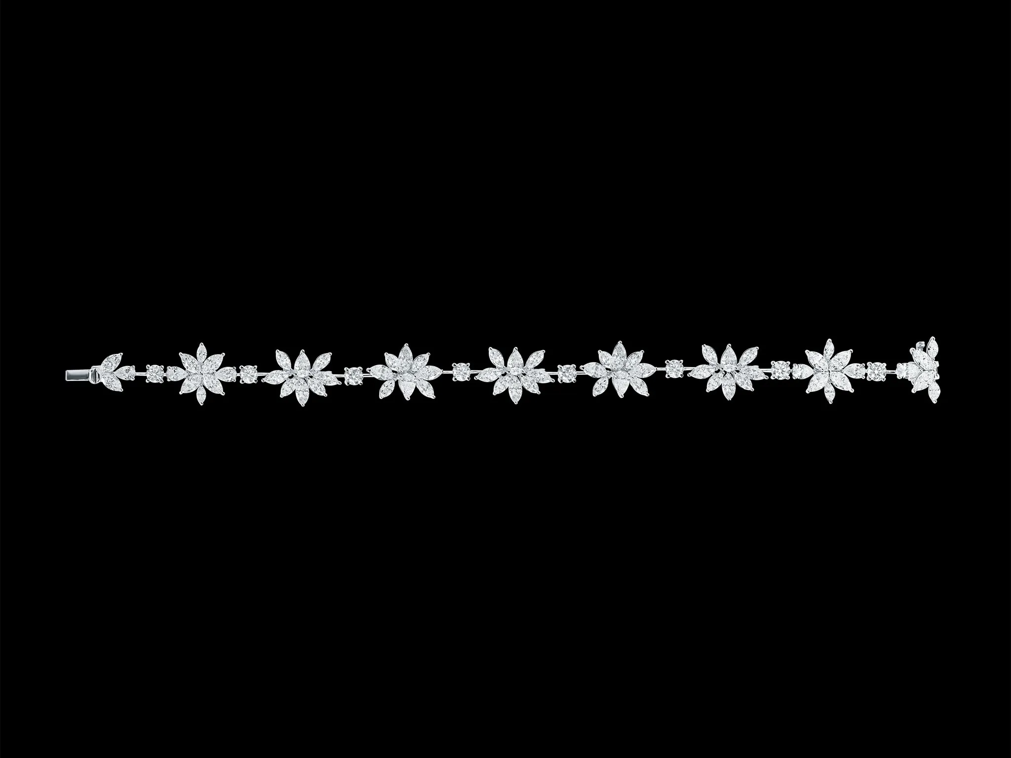 Diamond flower and marquise line bracelet in white gold
