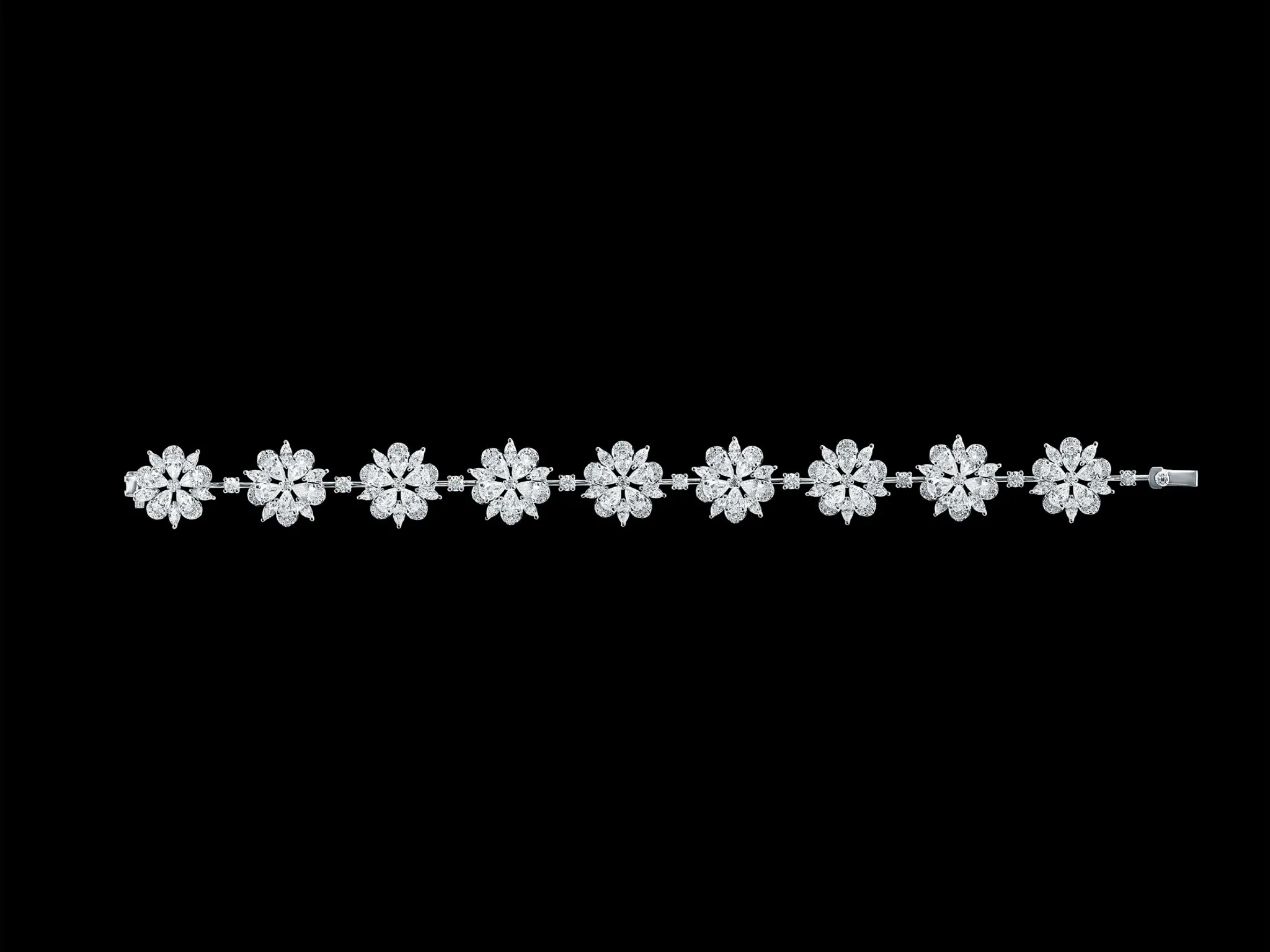 Diamond floral cluster tennis bracelet in white gold