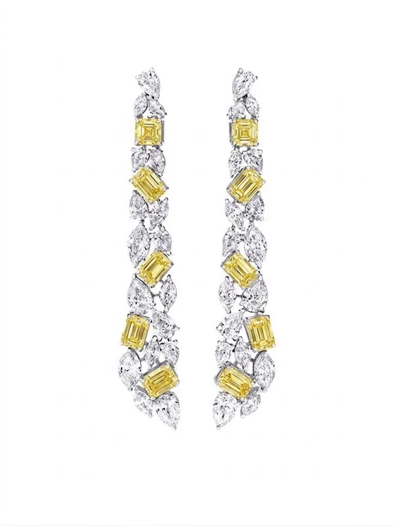 Yellow and white diamond drop earrings with emerald-cut and pear stones