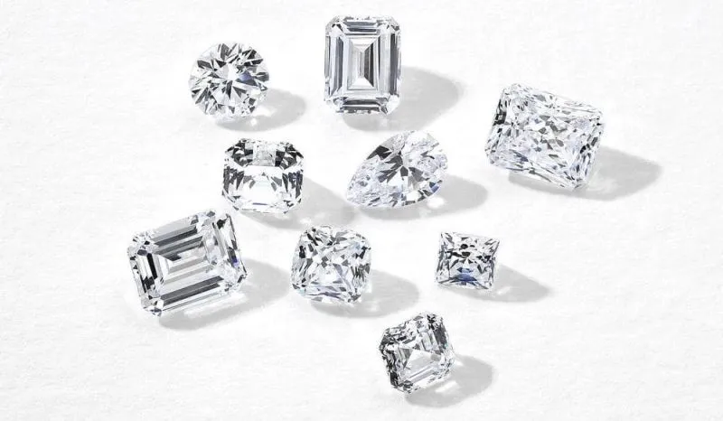 Assorted certified diamonds in round, emerald, cushion and oval cuts