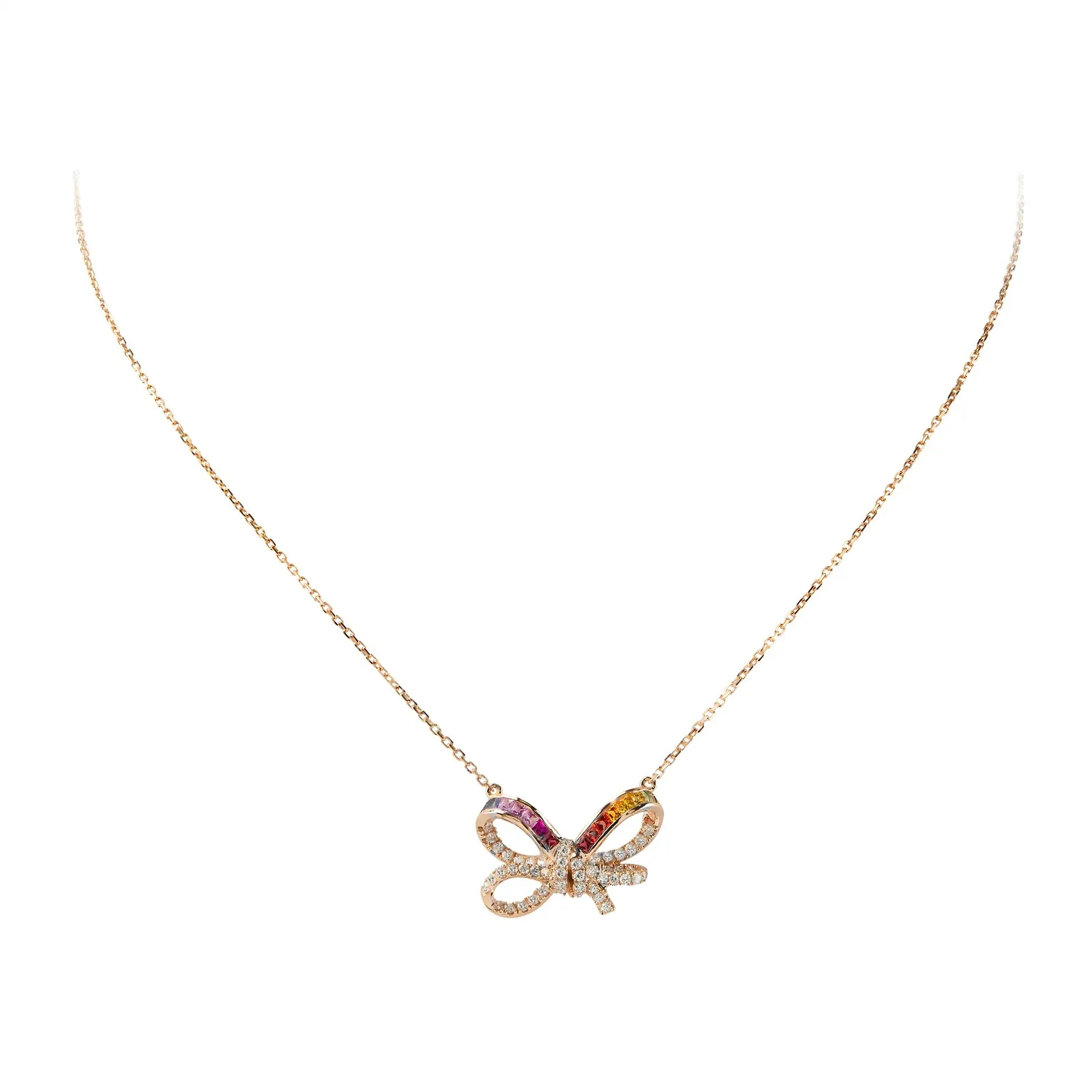 Rose gold diamond and ruby bow pendant on a fine chain